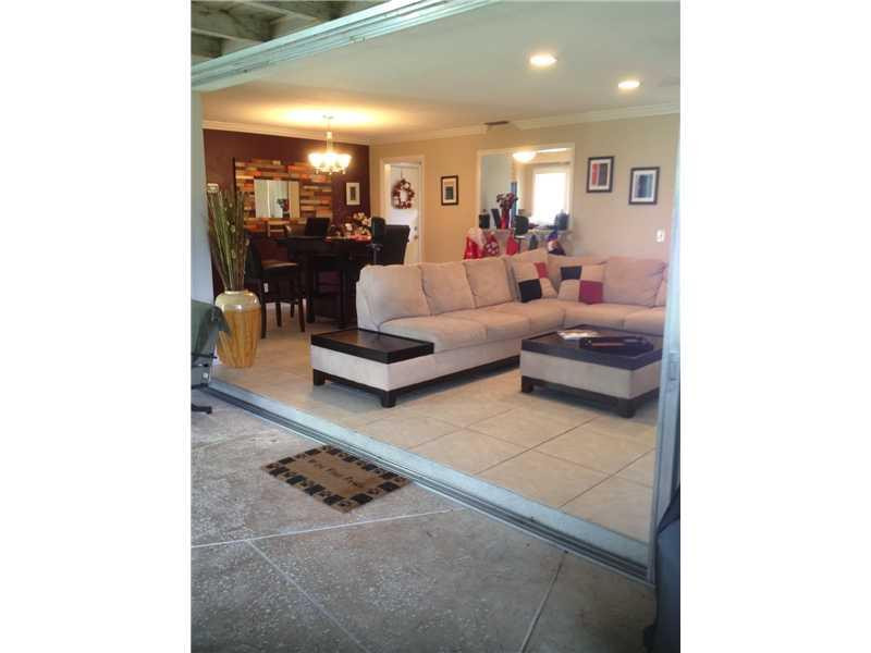 399 Southwest 12th Avenue Boca Raton, FL 33486 - Photo 16 of 19 a living room with furniture and view of kitchen