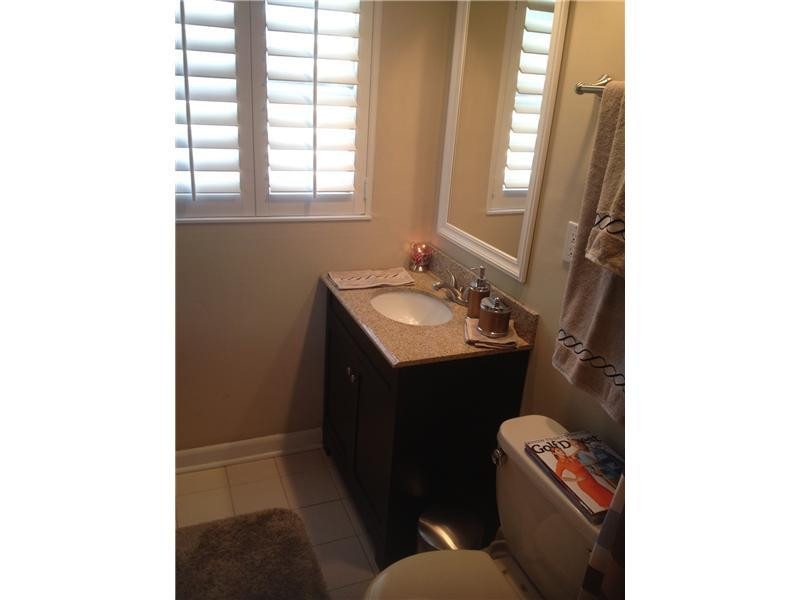 399 Southwest 12th Avenue Boca Raton, FL 33486 - Photo 19 of 19 a bathroom with a sink and a toilet