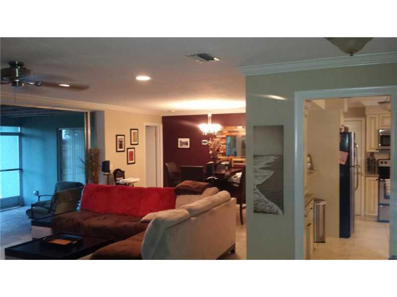 399 Southwest 12th Avenue Boca Raton, FL 33486 - Photo 7 of 19 a living room with furniture and a flat screen tv