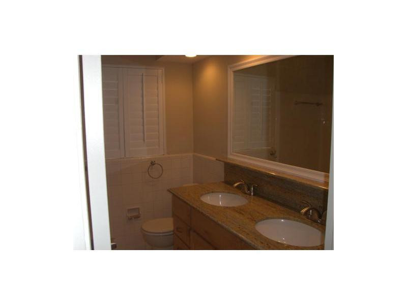 399 Southwest 12th Avenue Boca Raton, FL 33486 - Photo 9 of 19 a bathroom with a sink and mirror