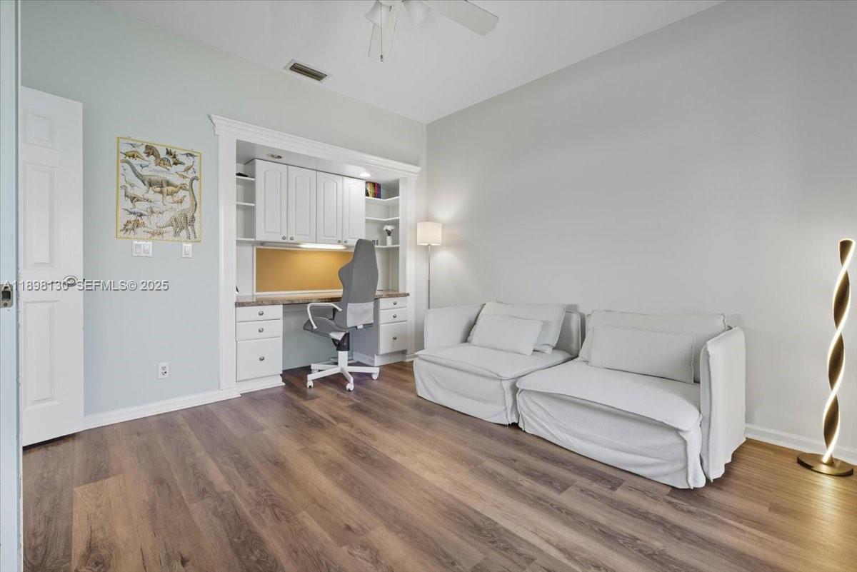 347 Fairmont Road Weston, FL 33326 - Photo 17 of 42 a living room with furniture and a wooden floor
