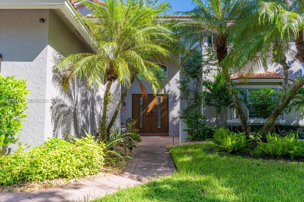 347 Fairmont Road Weston, FL 33326 - Photo 2 of 42 a view of a backyard with plants