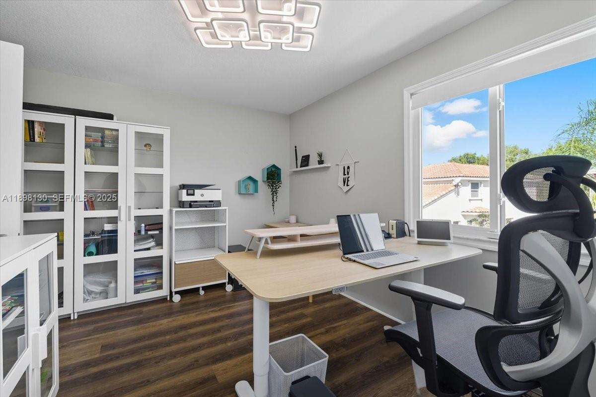 347 Fairmont Road Weston, FL 33326 - Photo 21 of 42 a view of a workspace with furniture and a window