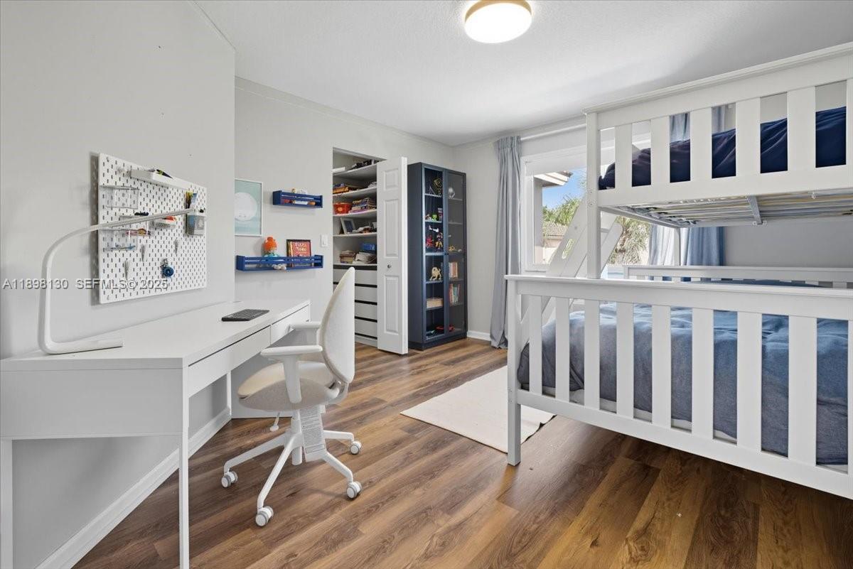 347 Fairmont Road Weston, FL 33326 - Photo 26 of 42 a dining room with furniture and wooden floor