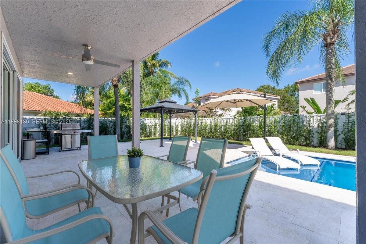 347 Fairmont Road Weston, FL 33326 - Photo 34 of 42 swimming pool view with a seating space
