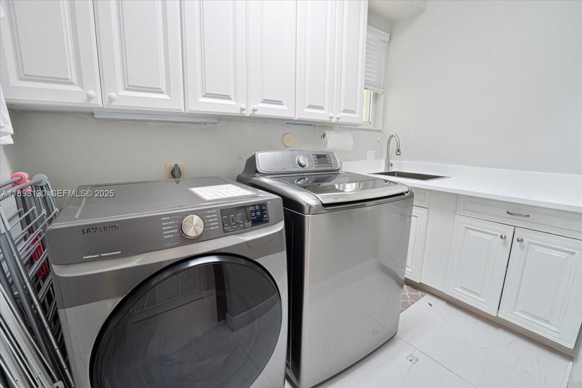347 Fairmont Road Weston, FL 33326 - Photo 36 of 42 a utility room with sink dryer and washer