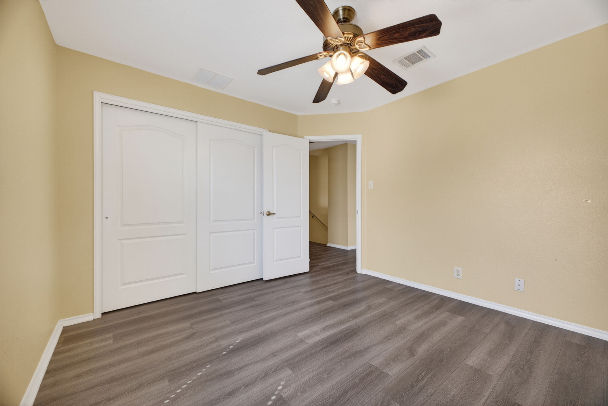 8813 Wiley Way Austin, TX 78747 - Photo 28 of 39 Third bedroom with sliding door closets and ceiling fan