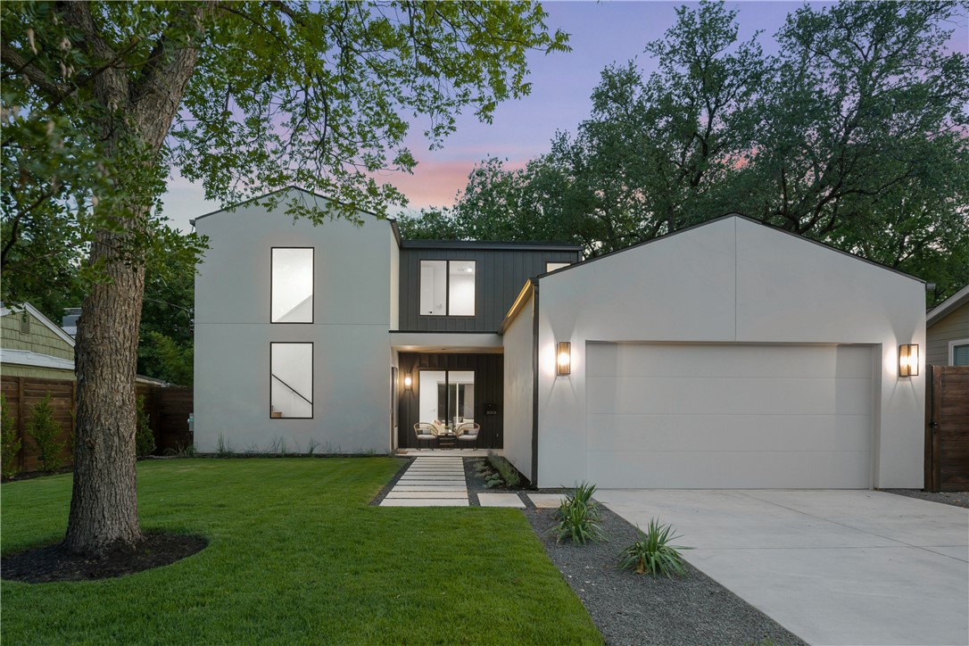 2003 Alguno Road Austin, TX 78757 - Photo 1 of 1 a front view of a house with a yard and garage