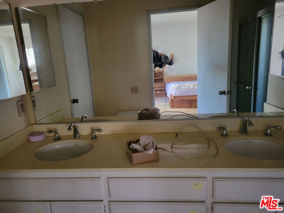 20224 Sherman Way, Unit 27 Canoga Park, CA 91306 - Photo 11 of 13 a bathroom with a sink and a mirror