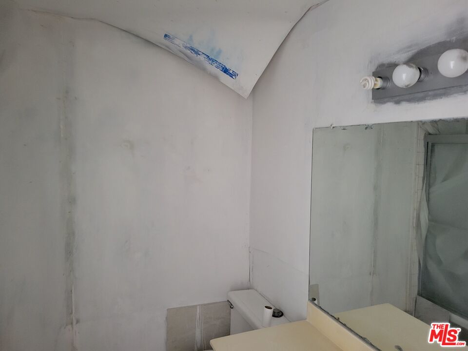 20224 Sherman Way, Unit 27 Canoga Park, CA 91306 - Photo 13 of 13 a bathroom with a toilet and a shower