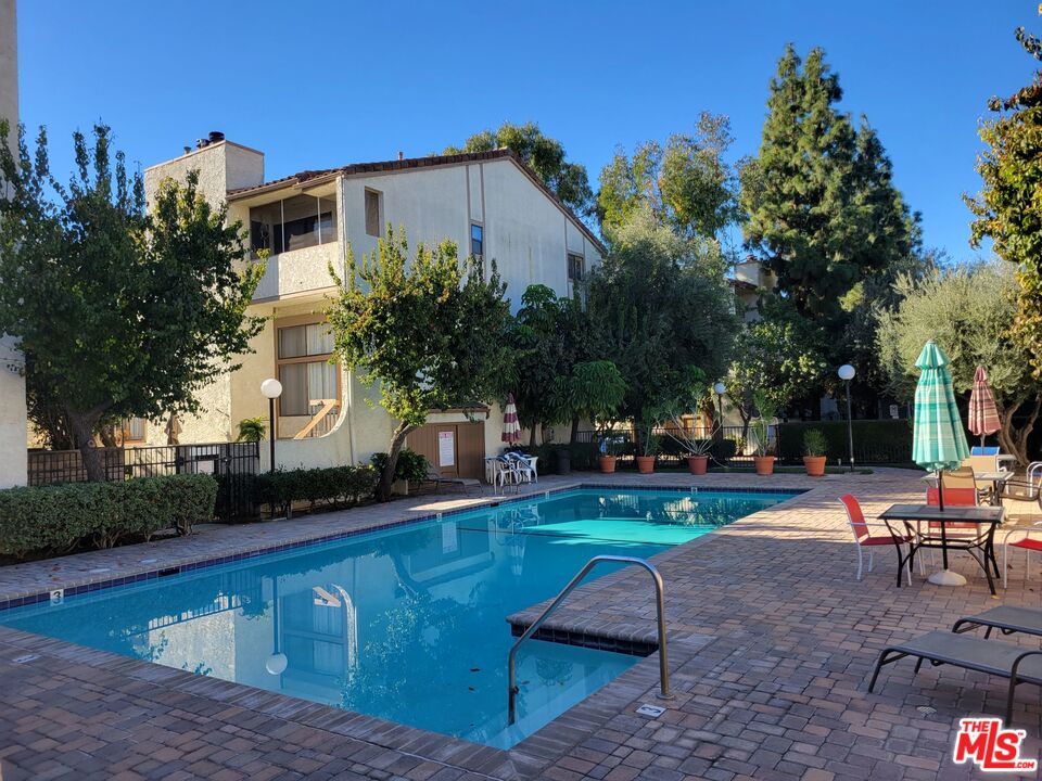 20224 Sherman Way, Unit 27 Canoga Park, CA 91306 - Photo 2 of 13 a view of a house with backyard and sitting area