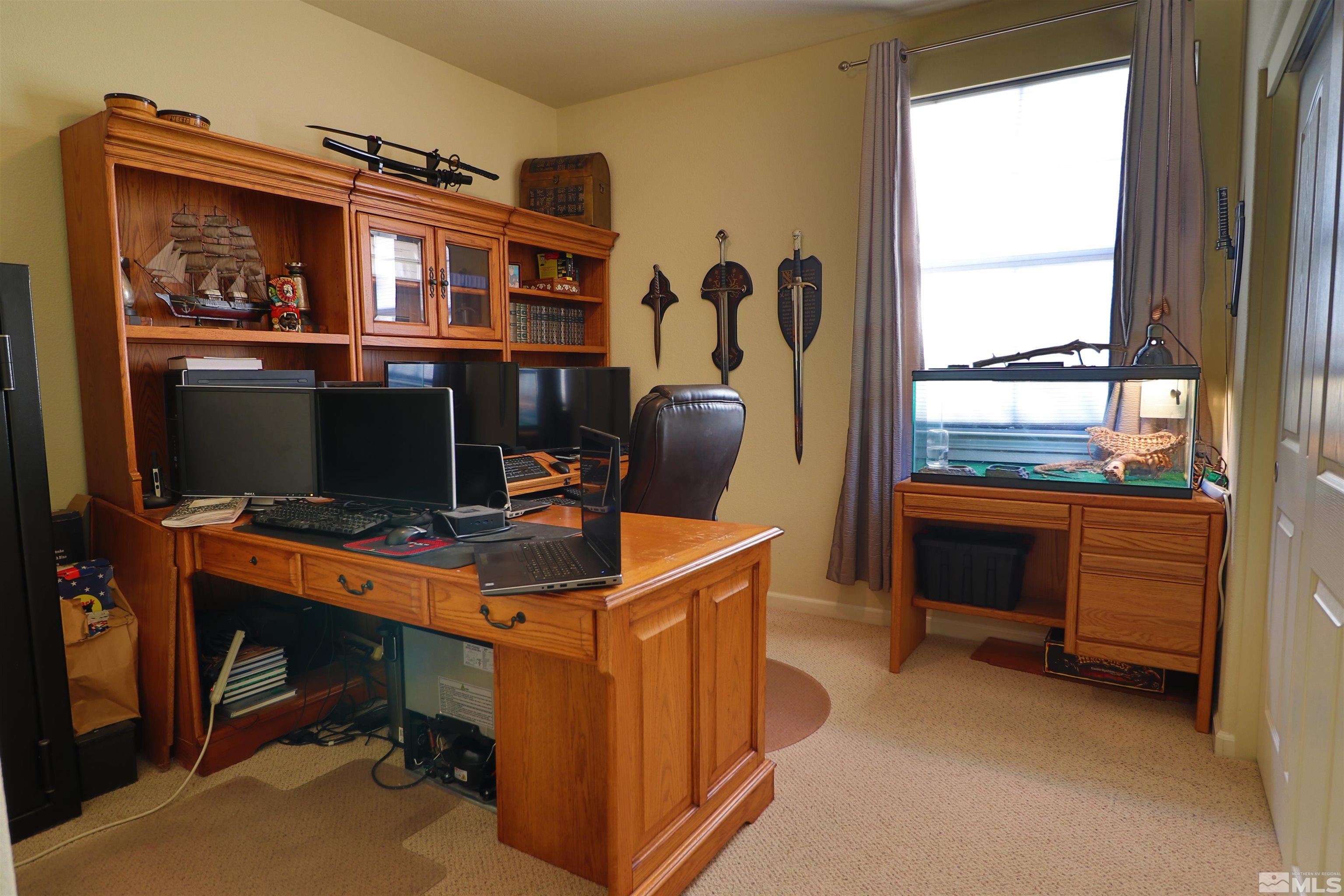 2491 Spring Flower Drive Reno, NV 89521 - Photo 14 of 19 a view of a workspace with furniture and a window