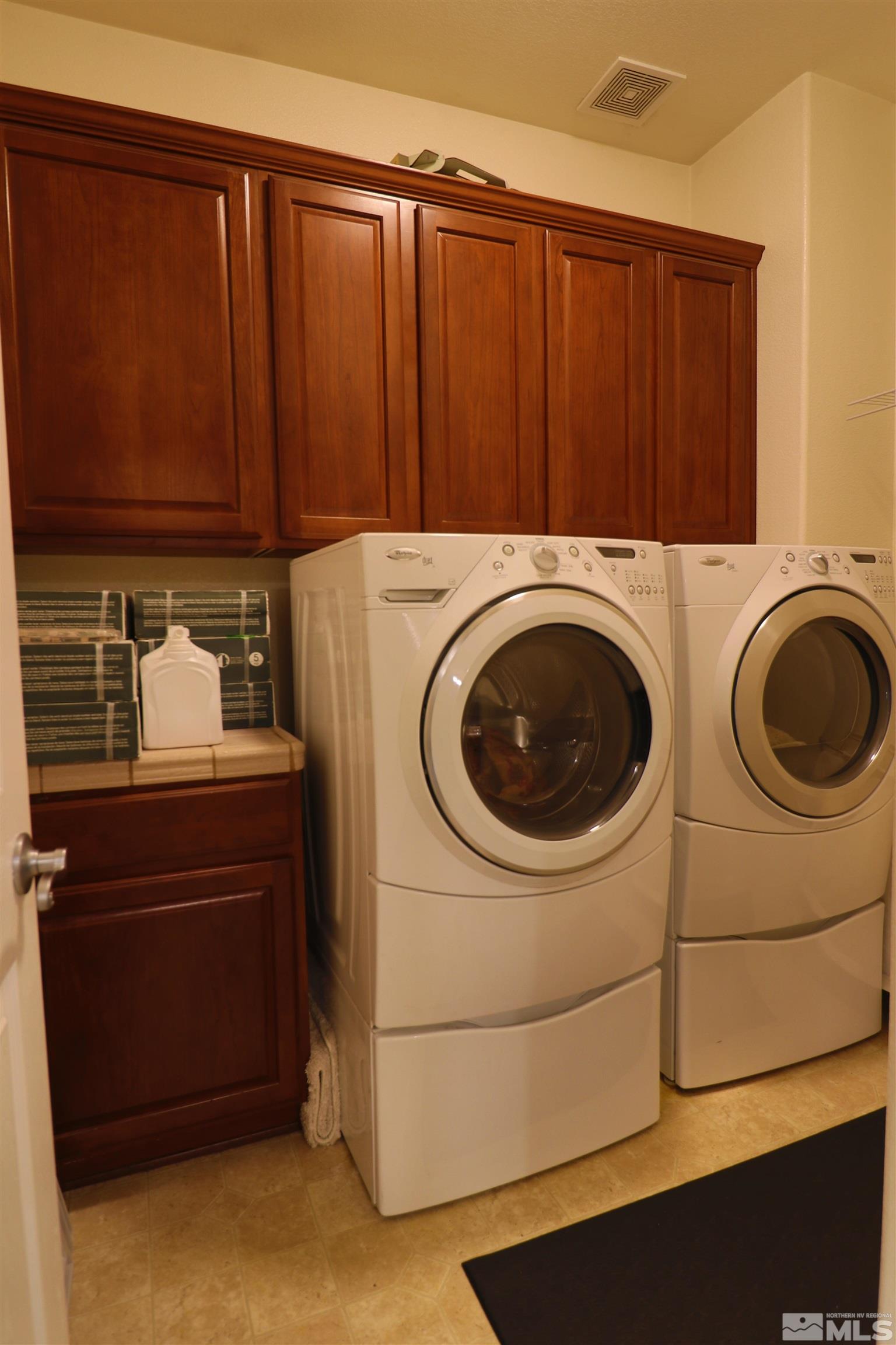 2491 Spring Flower Drive Reno, NV 89521 - Photo 16 of 19 a utility room with dryer and washer