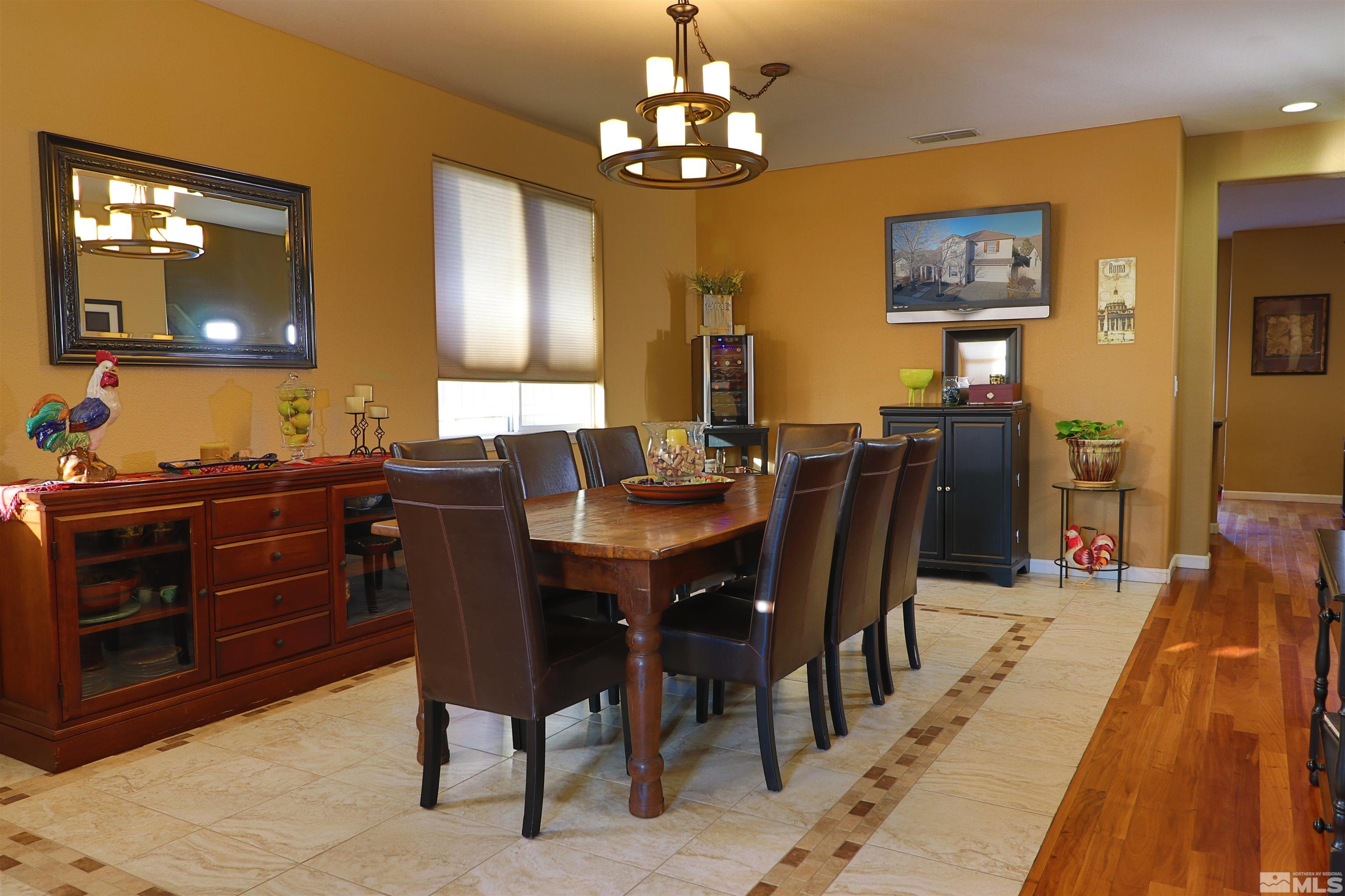 2491 Spring Flower Drive Reno, NV 89521 - Photo 2 of 19 a view of a dining room with furniture and chandelier