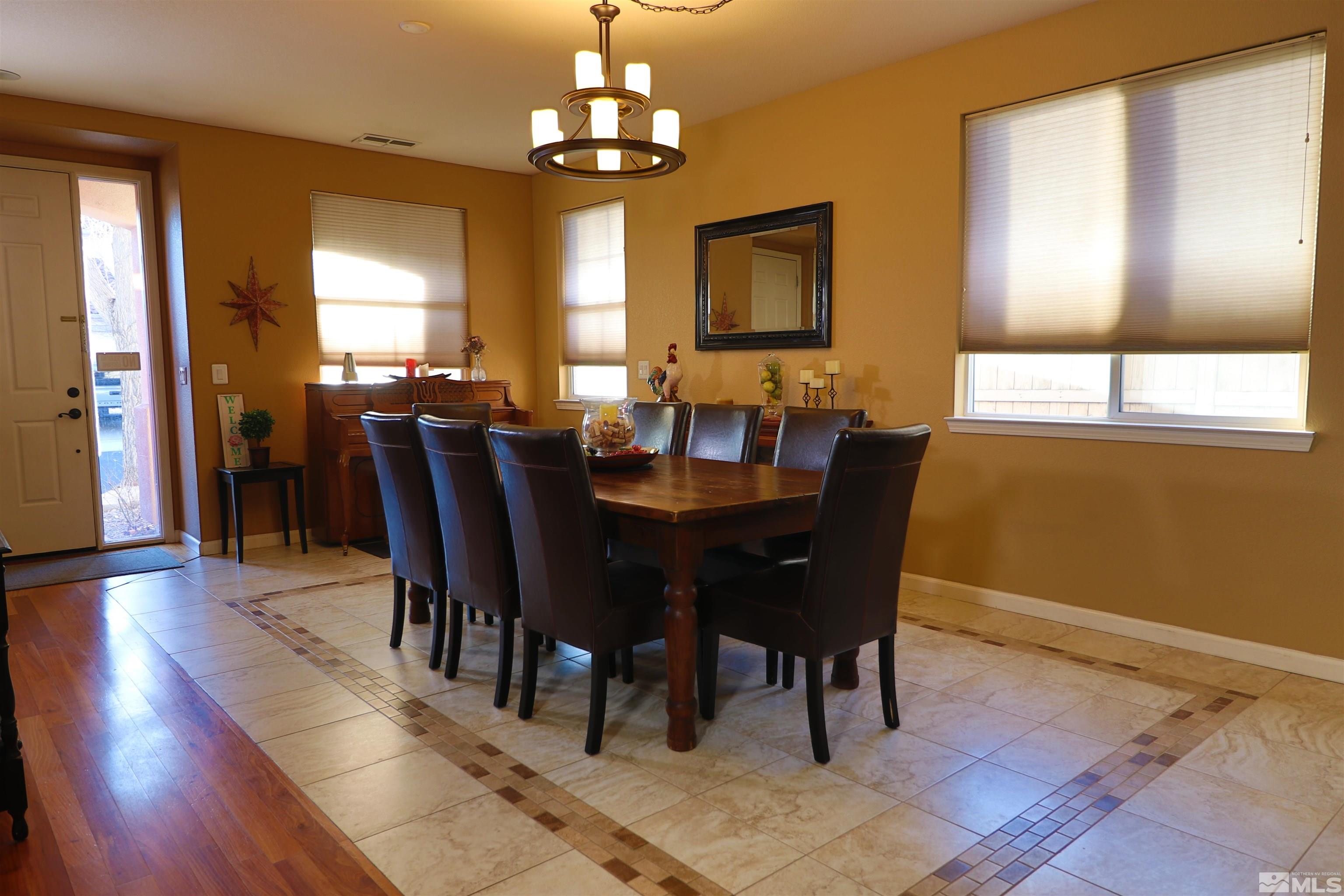 2491 Spring Flower Drive Reno, NV 89521 - Photo 3 of 19 a view of a dining room with furniture window and wooden floor