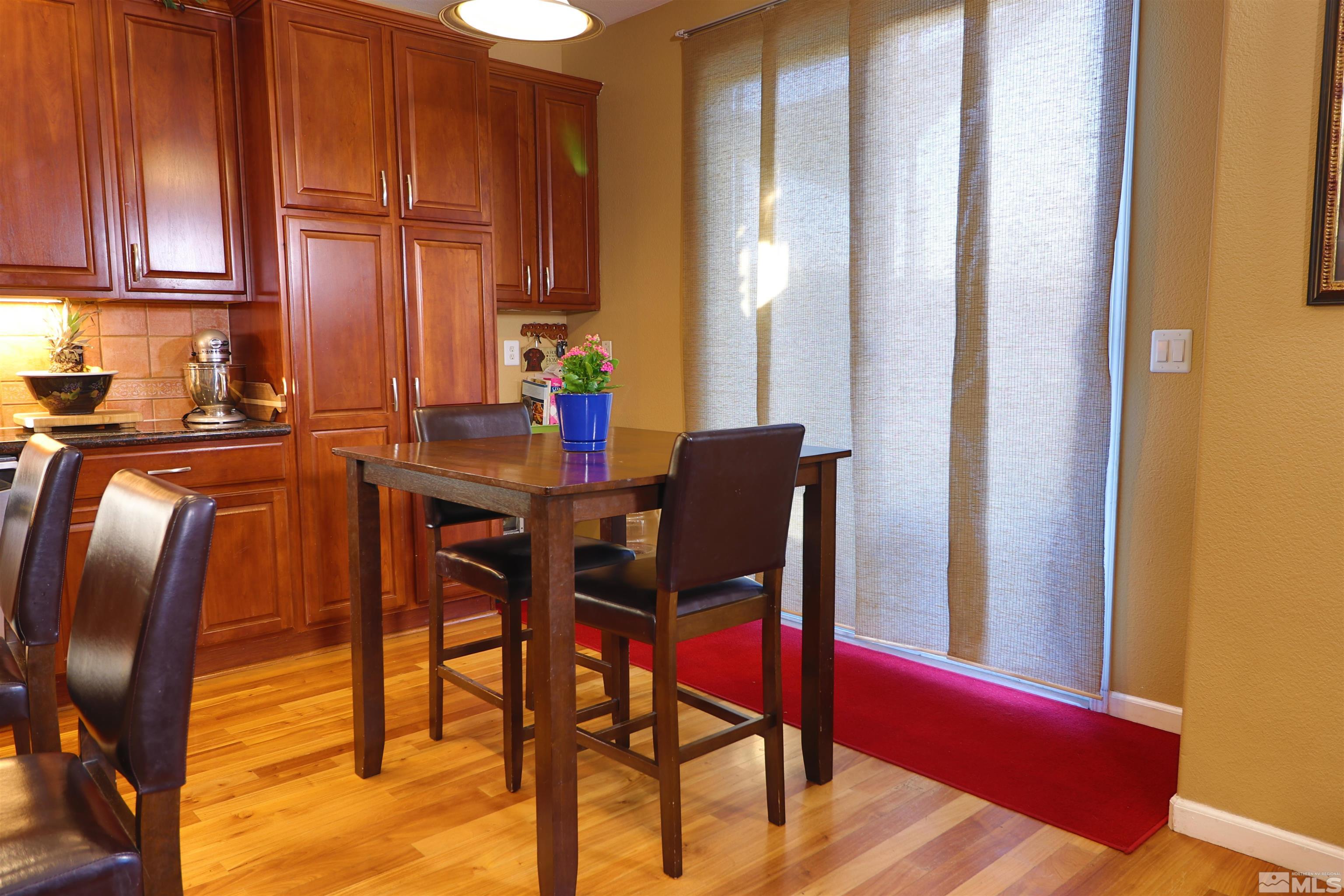 2491 Spring Flower Drive Reno, NV 89521 - Photo 5 of 19 a view of a dining room with furniture and a window