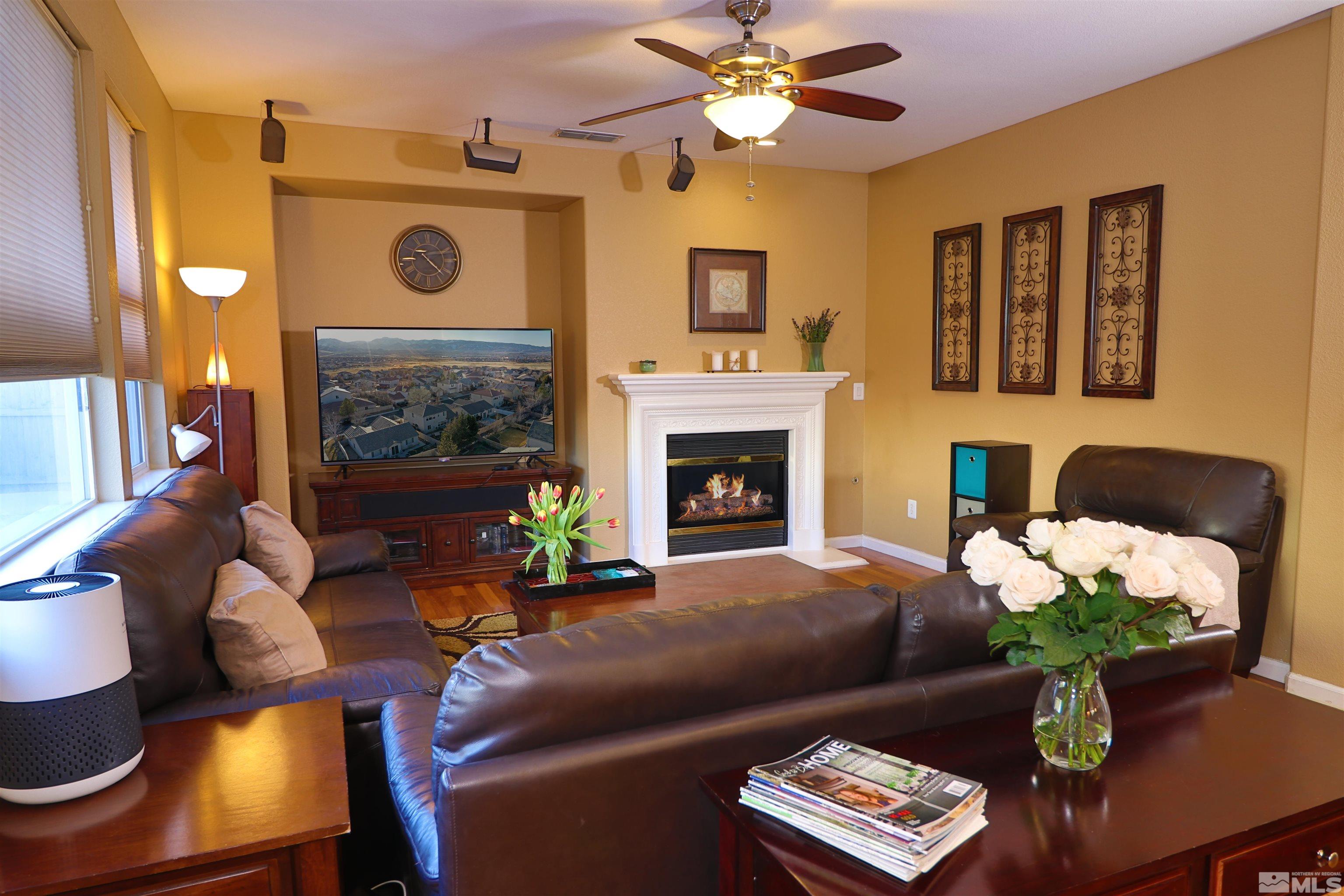 2491 Spring Flower Drive Reno, NV 89521 - Photo 6 of 19 a living room with furniture and a fireplace