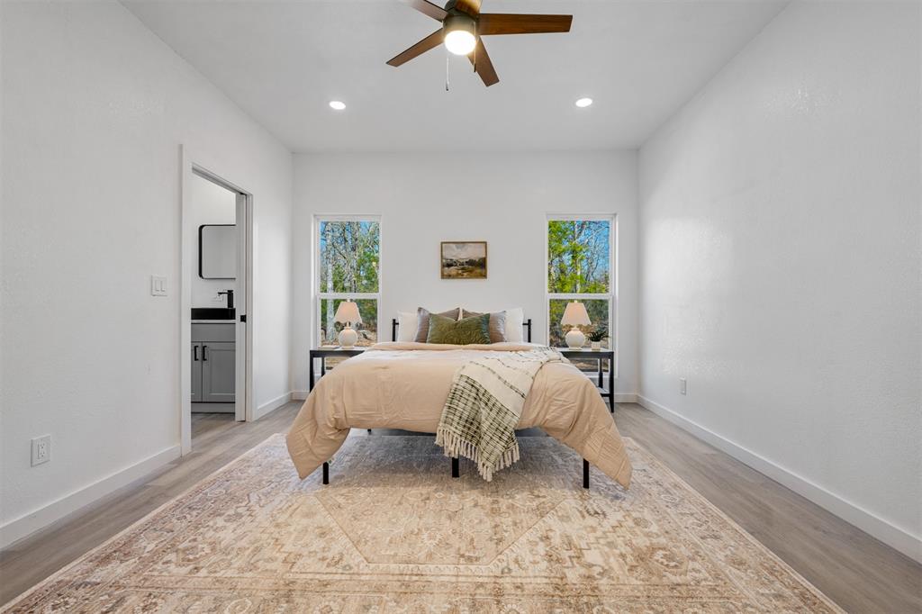 260 Private Road Sumner, TX 75486 - Photo 11 of 23 a bed room with a bed and a window