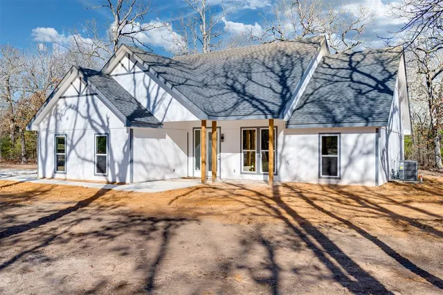 a view of a house with a snow in a yard