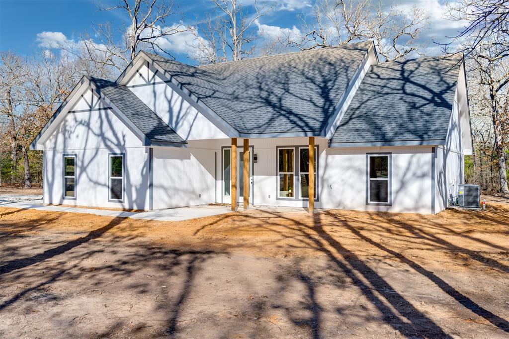 260 Private Road Sumner, TX 75486 - Photo 2 of 23 a view of a house with a snow in a yard