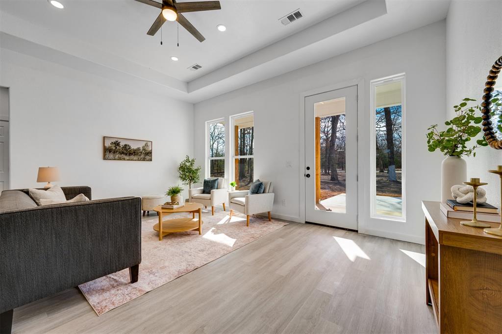260 Private Road Sumner, TX 75486 - Photo 5 of 23 a living room with furniture and wooden floor