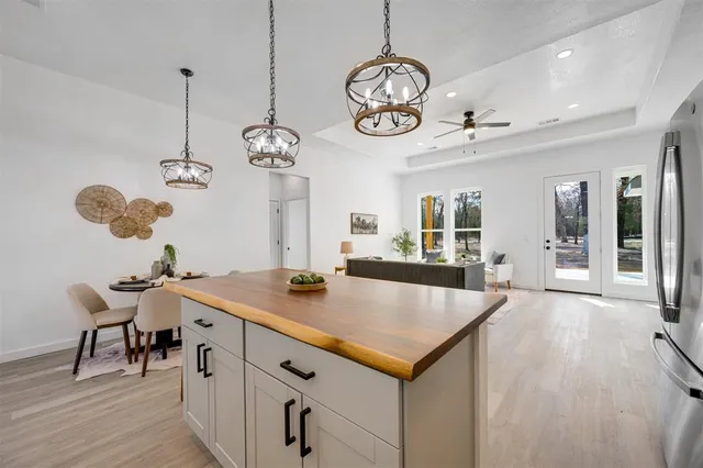 an open kitchen with a table and chairs