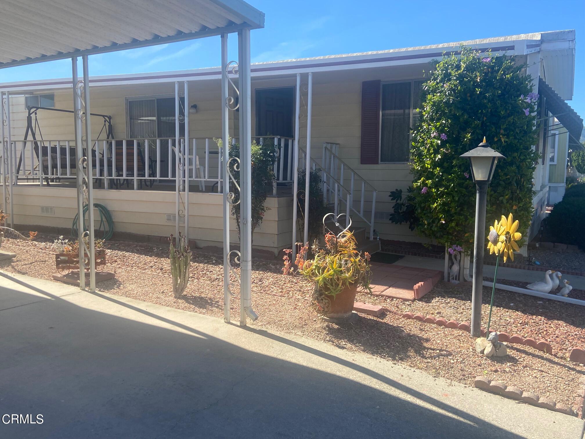 250 East Telegraph Road, Unit 76 Fillmore, CA 93015 - Photo 3 of 25 a view of a porch of a house with a patio