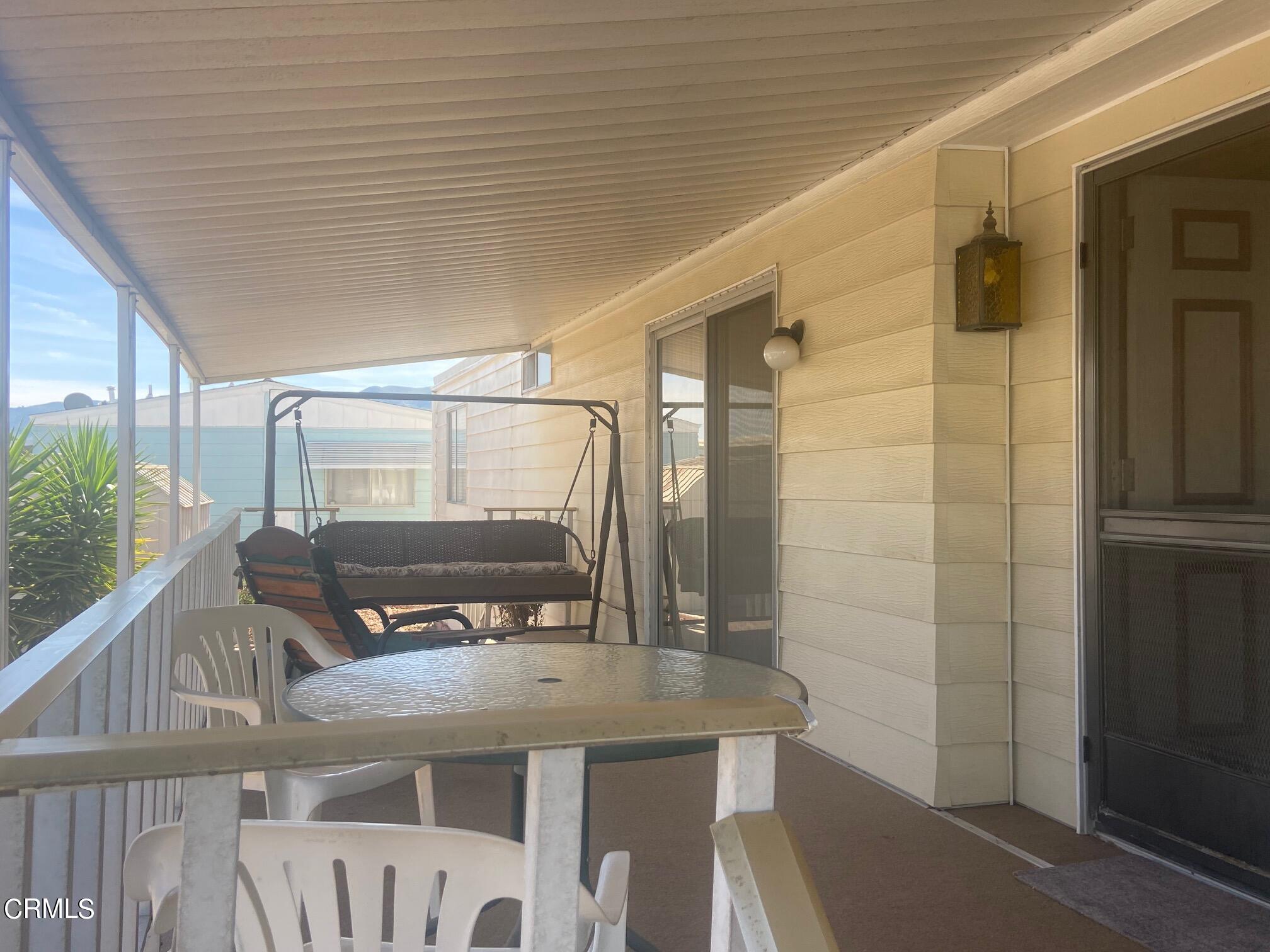250 East Telegraph Road, Unit 76 Fillmore, CA 93015 - Photo 6 of 25 a balcony with table and chairs
