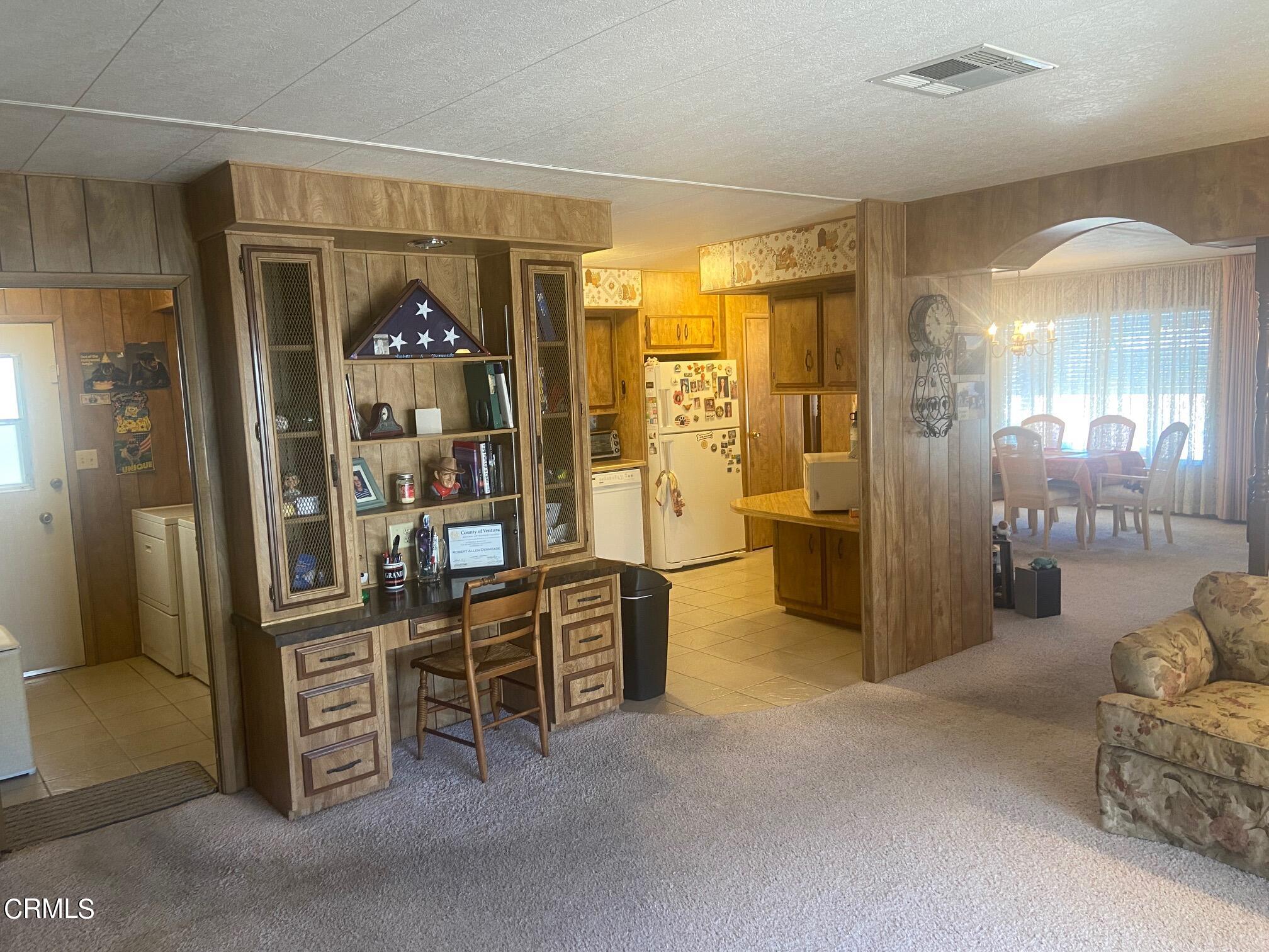250 East Telegraph Road, Unit 76 Fillmore, CA 93015 - Photo 9 of 25 a view of a livingroom with furniture and an empty room