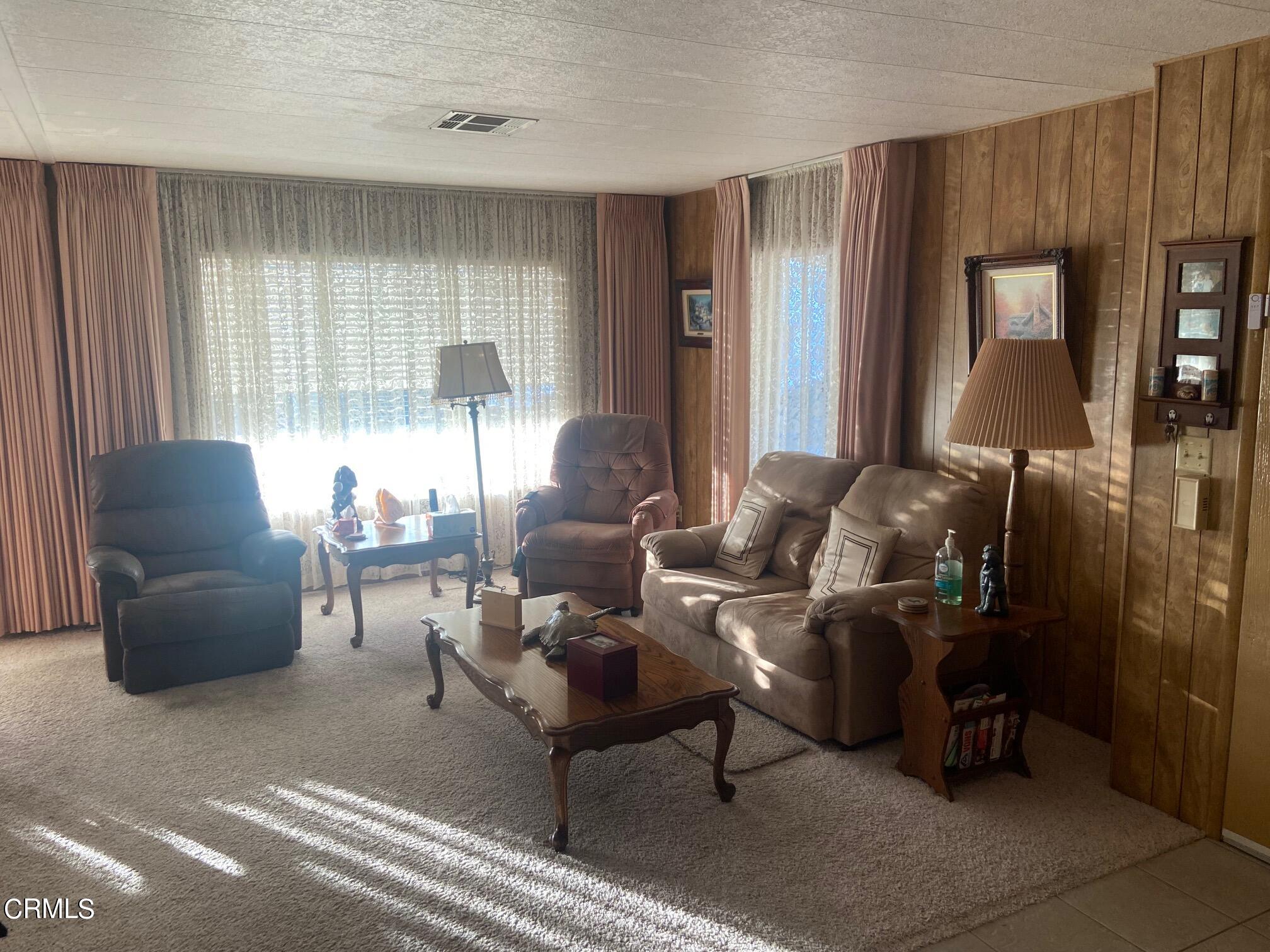 250 East Telegraph Road, Unit 76 Fillmore, CA 93015 - Photo 10 of 25 a living room with furniture and a large window