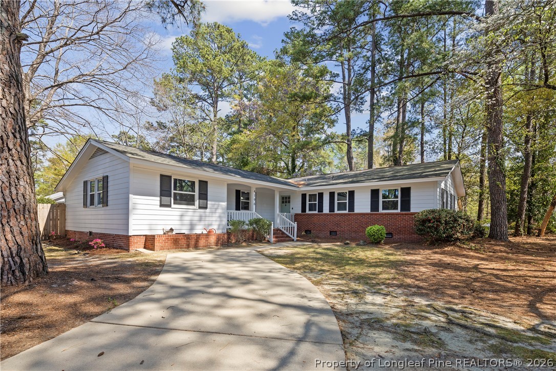 4196 Cliffdale Road Fayetteville, NC 28303 - Photo 1 of 38 a house that has a tree in front of it
