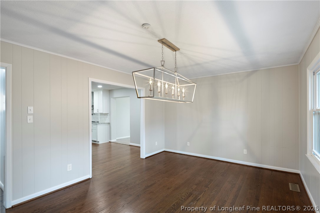4196 Cliffdale Road Fayetteville, NC 28303 - Photo 20 of 38 a view of an empty room with wooden floor