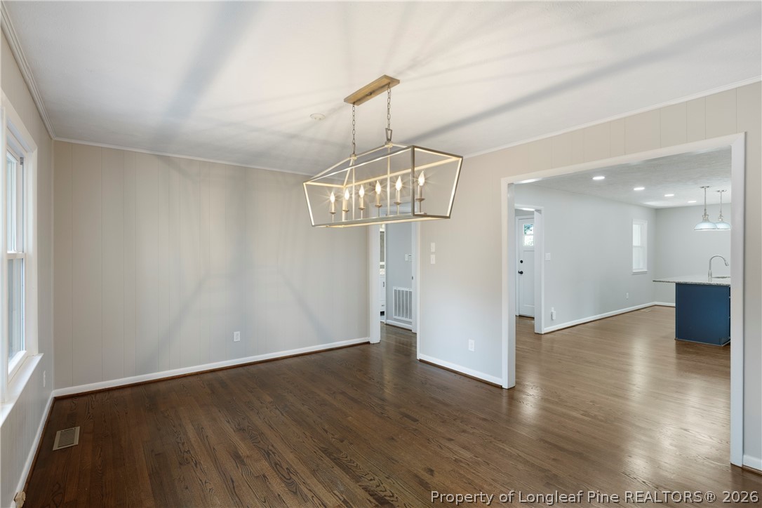 4196 Cliffdale Road Fayetteville, NC 28303 - Photo 21 of 38 a view of an empty room and wooden floor