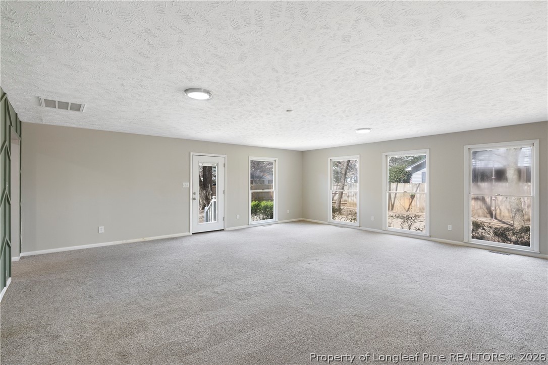 4196 Cliffdale Road Fayetteville, NC 28303 - Photo 25 of 38 a view of an empty room with window and cabinet