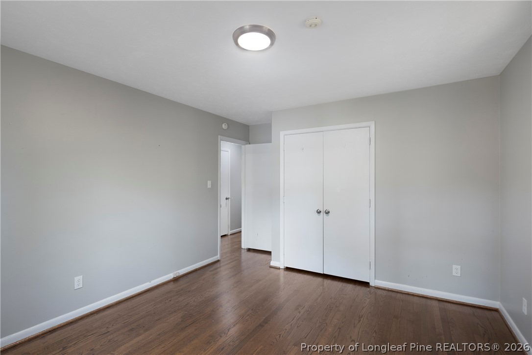4196 Cliffdale Road Fayetteville, NC 28303 - Photo 33 of 38 a view of an empty room and wooden floor