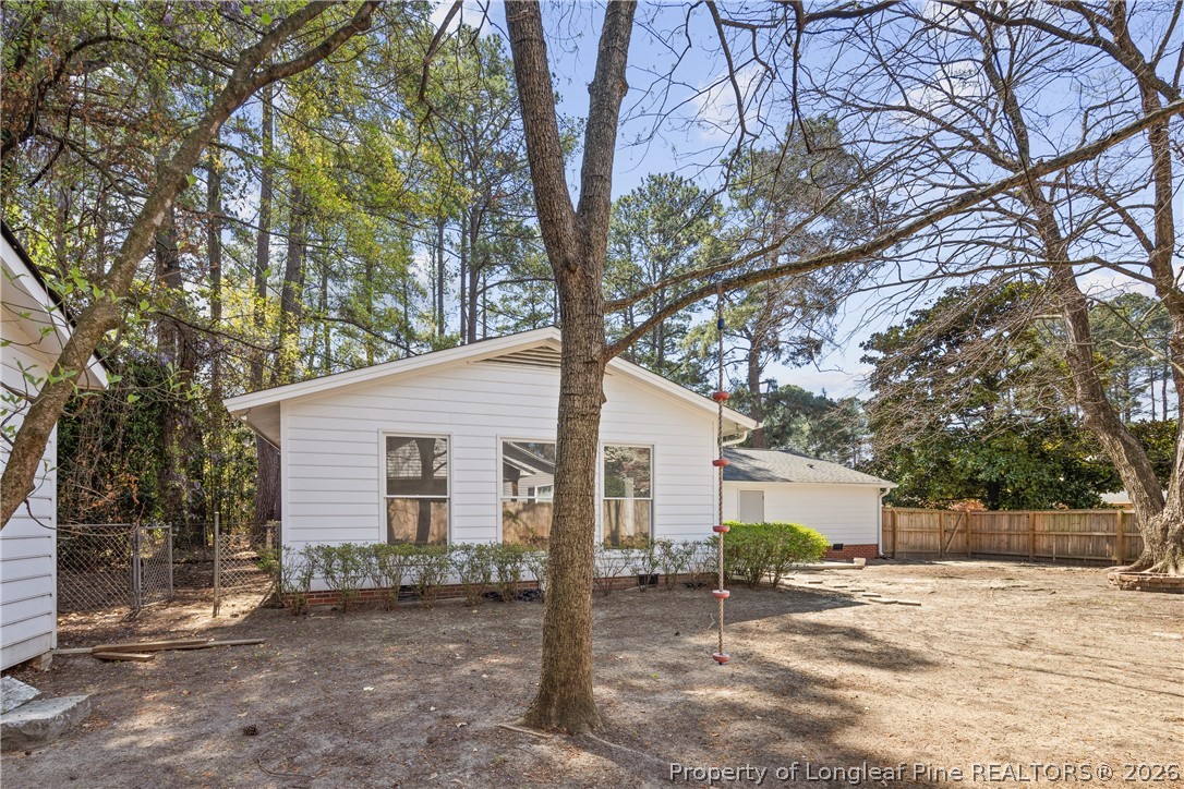 4196 Cliffdale Road Fayetteville, NC 28303 - Photo 36 of 38 a white house that has a tree in front of it
