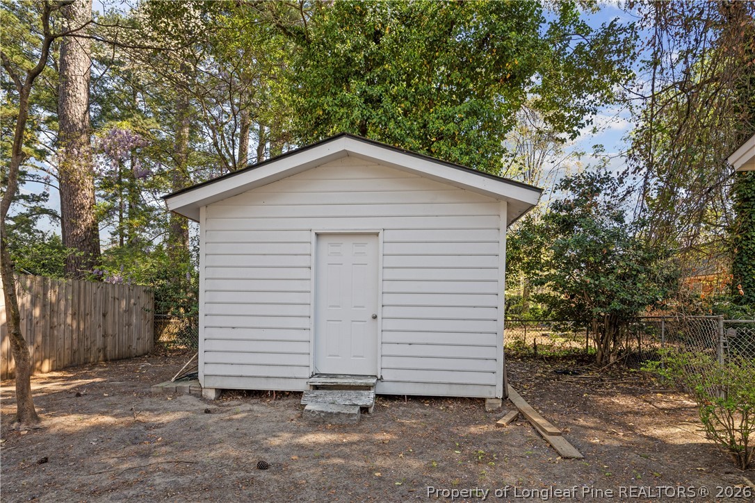 4196 Cliffdale Road Fayetteville, NC 28303 - Photo 37 of 38 a small white house with a outdoor space