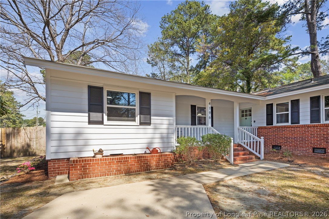 4196 Cliffdale Road Fayetteville, NC 28303 - Photo 4 of 38 a view of a house with a patio