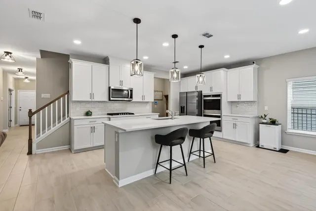 a bathroom with a double vanity sink mirror and