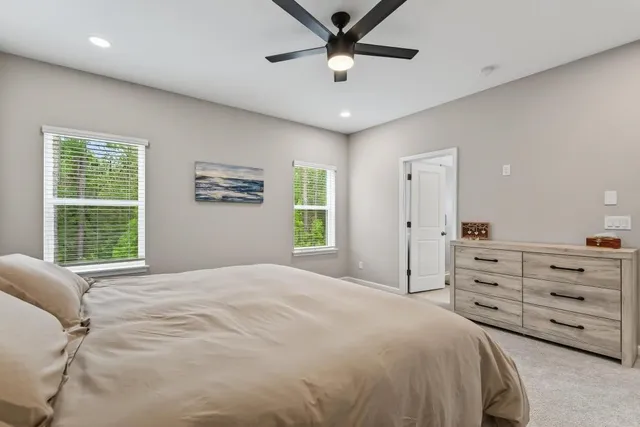 a bathroom with a sink toilet and mirror