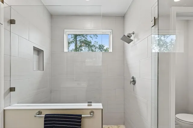 a bedroom with furniture and a window