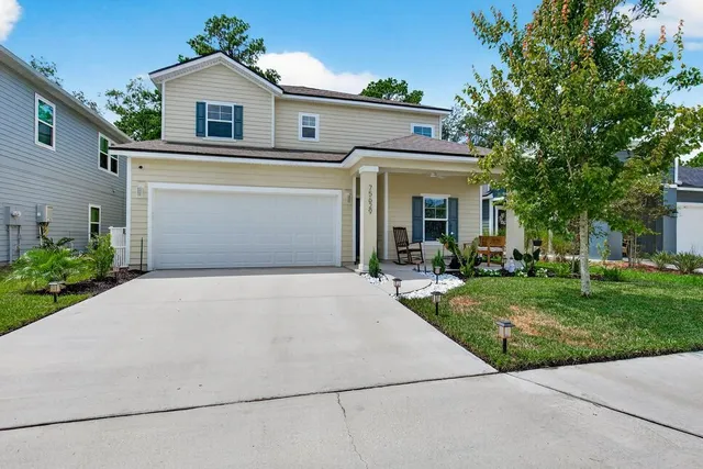 front view of a house with a yard