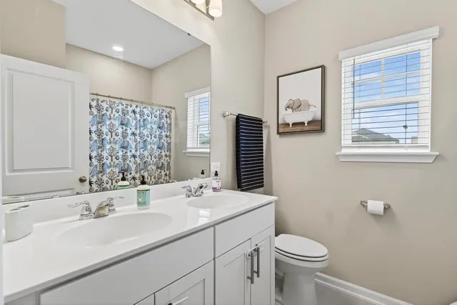 a view of a house with a yard and plants