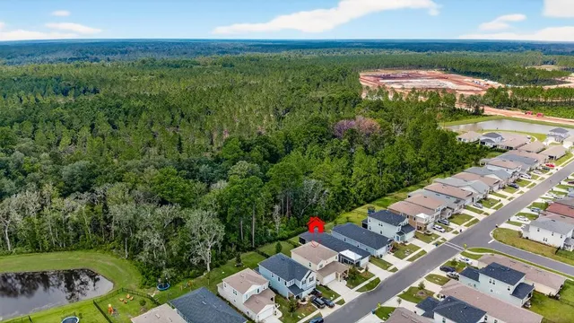 a kitchen with stainless steel appliances kitchen island granite countertop a refrigerator and a sink