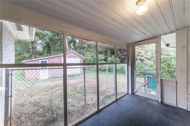 a view of a room that has a large window