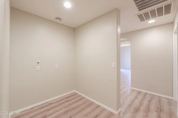 a view of a small space with wooden floor