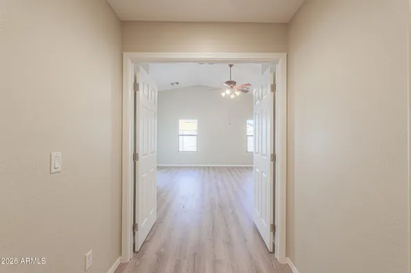 a view of a room with wooden floor