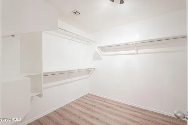 a view of an empty walk in closet