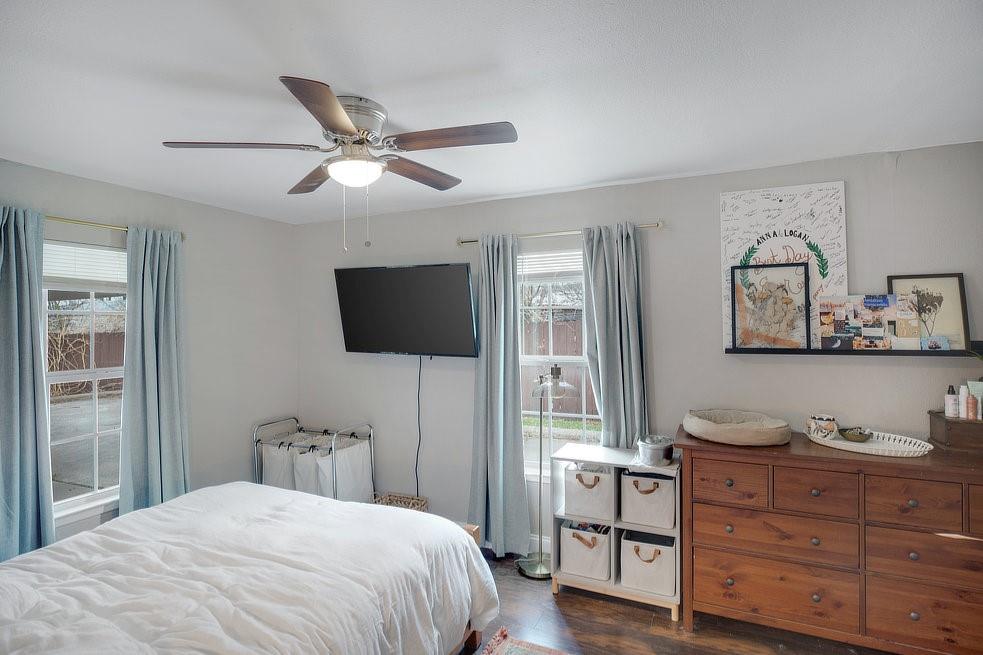 4029 Knox Street Fort Worth, TX 76119 - Photo 12 of 28 a bedroom with a bed and a flat screen tv