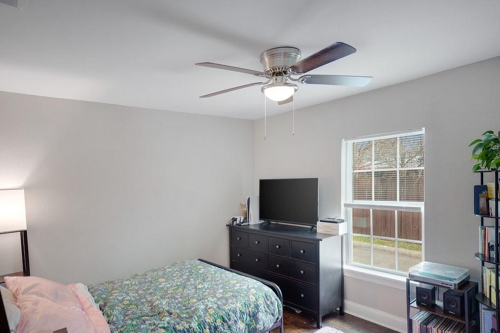 4029 Knox Street Fort Worth, TX 76119 - Photo 18 of 28 a bedroom with a bed and a television